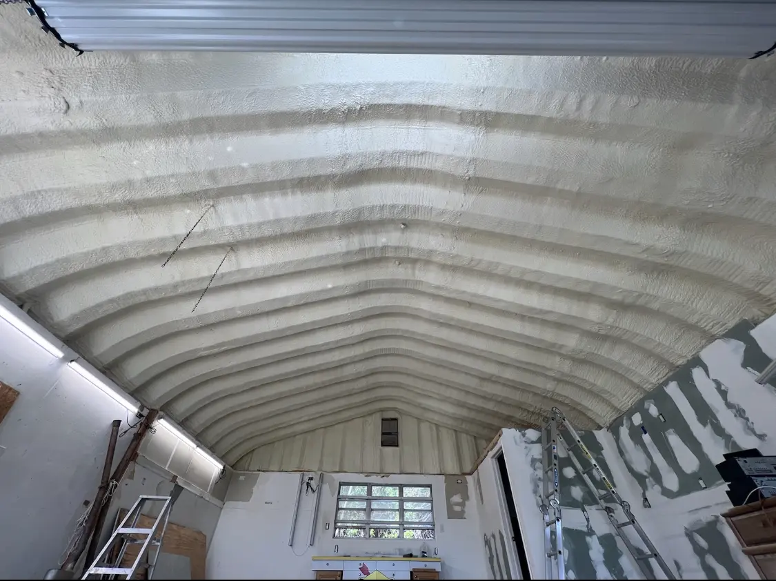 Spray polyurethane foam applied to the underside of a metal roof deck in Palmyra